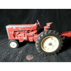 Vintage Ertl Red International Harvester Tractor w/ a working Hay Rake