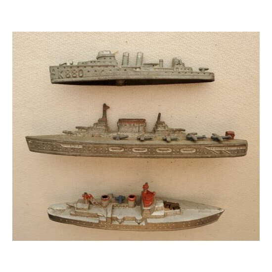 3 vintage metal toy military ships, 2 Tootsie Toy, an aircraft carrier, etc. {1}