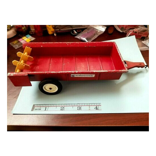 Vintage early ERTL International Harvester Manure Spreader, Red, Metal, 8" box {1}