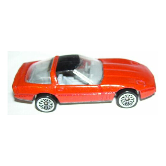1:64 1982 Malaysia Hot wheels diecast 80s corvette metallic red w/ black roof {2}